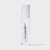 Eine transparente Tube Glazed Sweet von LH Cosmetics mit weißem Deckel und transparentem Inhalt vor weißem Hintergrund.