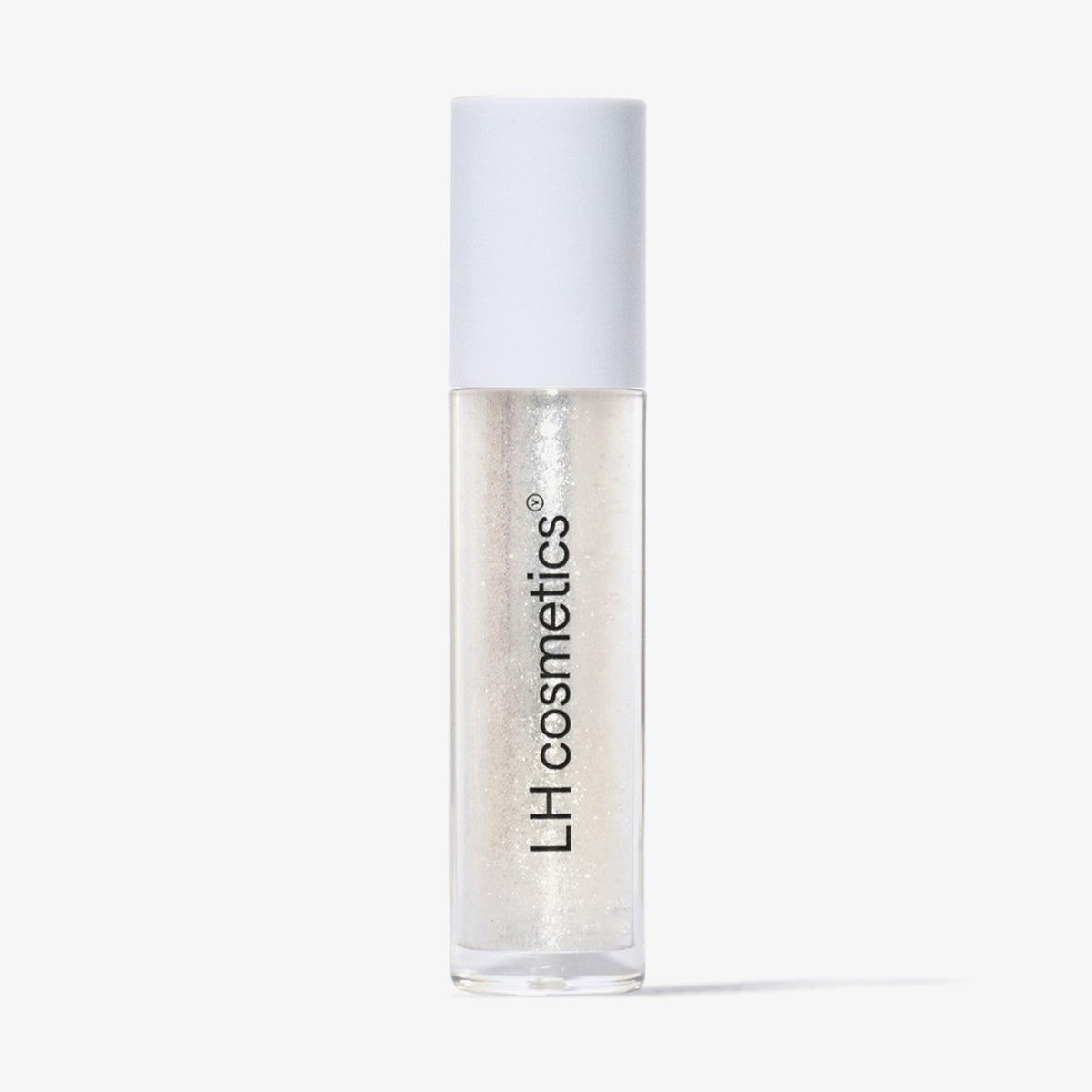 Eine transparente Tube Glazed Yum von LH Cosmetics mit weißem Deckel und klar glitzerndem Inhalt vor weißem Hintergrund.