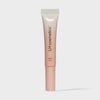 Eine Tube Plush Cozy von LH Cosmetics mit weiß-rosa Farbverlauf auf weißem Hintergrund.