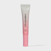 Eine Tube Plush Dreamy von LH Cosmetics mit weiß-rosa Farbverlauf auf weißem Hintergrund.
