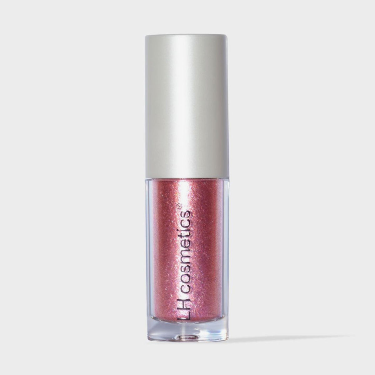 Transparente Tube Sparkl von LH Cosmetics mit weißer Kappe und pink schimmerndem Farbton namens Adore.