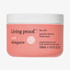 Rosafarbener Tiegel Living Proof Curl Elongator Pflegestyler für Locken mit weißem Deckel vor weißem Hintergrund.