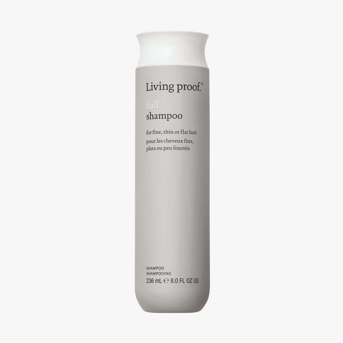 Graue Flasche Living Proof Full Shampoo mit weißem Deckel vor weißem Hintergrund.