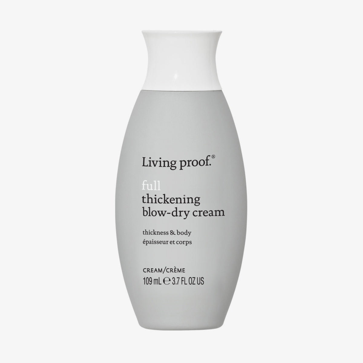 Eine graue bauchige Flasche Living Proof Full Thickening Blow-Dry Cream mit weißem Deckel vor weißem Hintergrund.