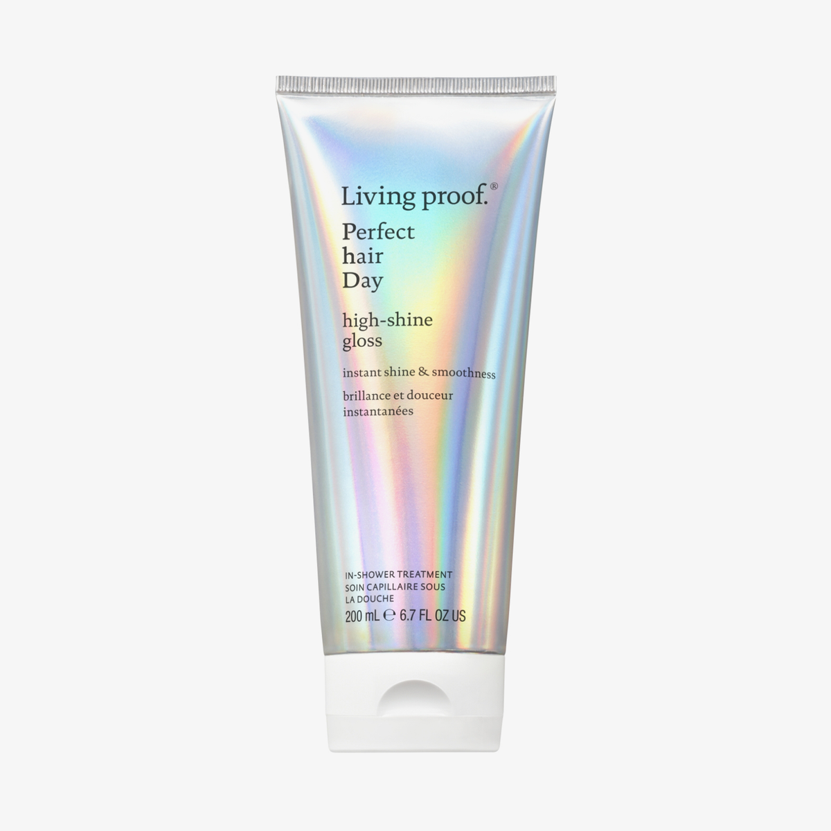 Eine holografisch glänzende Tube Living Proof High-Shine Gloss mit weißem Deckel vor weißem Hintergrund.