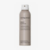 Beige Sprühdose Living Proof No Frizz Instant De-Frizzer mit weißem Sprühkopf vor weißem Hintergrund.