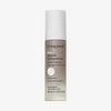 Beige Flasche Living Proof No Frizz Smooth Styling Serum mit Farbverlauf und weißem Deckel.