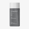 Graue kantige Flasche Living Proof Perfect Hair Day 5-in-1 Styling Treatment mit weißem Deckel.