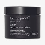 Schwarzer Tiegel Style Lab Amp Texture Volumizer von Living Proof vor weißem Hintergrund.