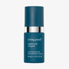 Dunkelblaue Flasche Living Proof Triple Bond Complex mit silbernem Detail vor weißem Hintergrund.