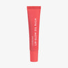 Rote Tube Lip Glow Oil Balm Juicy von Lumene auf weißem Hintergrund