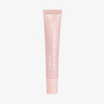 Eine hellrosa Tube Lip Glow Oil Balm Sugar von Lumene vor weißem Hintergrund