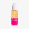 Transparente Flasche Lumene NORDIC-C [VALO] Arctic Berry Multivitamin Cocktail Oil mit gelber und pinker Schicht und weißer Pumpe.