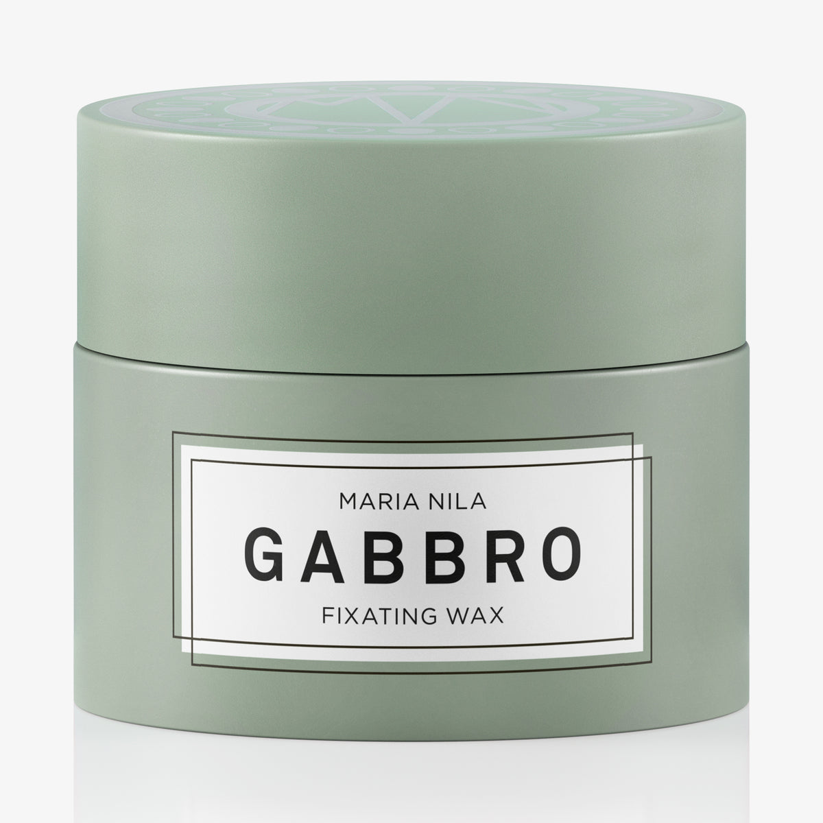 Grüner Teigel it maria nila Gabbro Fixating Wax vor einem weißen Hintergrund abgebildet.