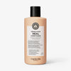 Pfirsichfarbene Flasche Head & Hair Heal Conditioner mit schwarzem Deckel auf weißem Hintergrund.