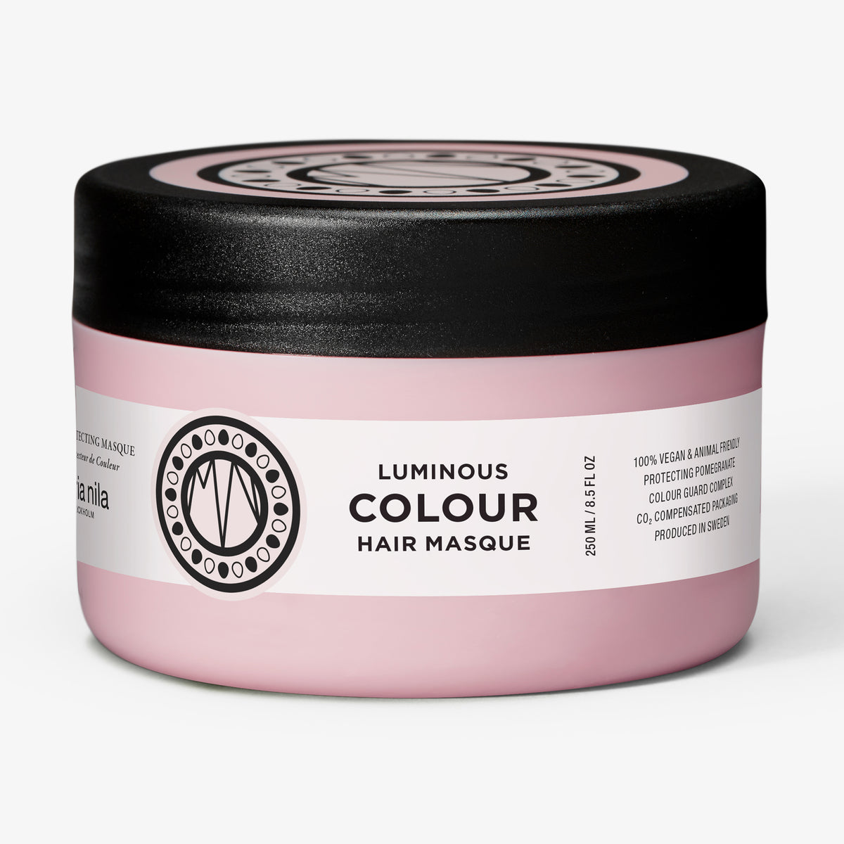 Rosafarbener Tiegel der Luminous Colour Masque von maria nila mit schwarzem Deckel vor weißem HIntergrund.