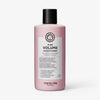 Eine rosafarbene Flasche maria nila Pure Volume Conditioner mit einer schwarzen Kappe und einem weißen Etikett.