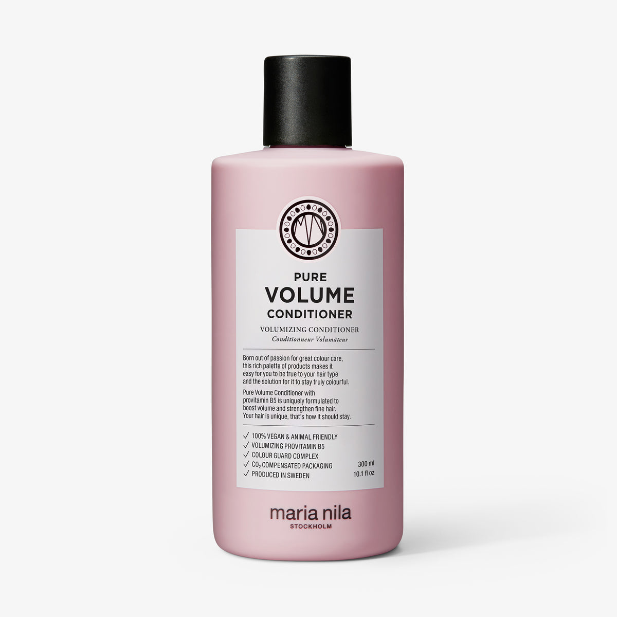 Eine rosafarbene Flasche maria nila Pure Volume Conditioner mit einer schwarzen Kappe und einem weißen Etikett.
