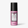Eine pinke Flasche maria nila Quick Dry Heat Spray mit schwarzem Deckel und weißem Produktetikett auf der Vorderseite.