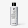 Die hellviolette Flasche von maria nila Sheer Silver Shampoo hat mit schwarzem Verschluss und detailliertem Etikett.