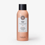 Pfirsichfarbene maria nila Sprühflasche für das Haarstyling, dargestellt auf einem weißen Hintergrund.