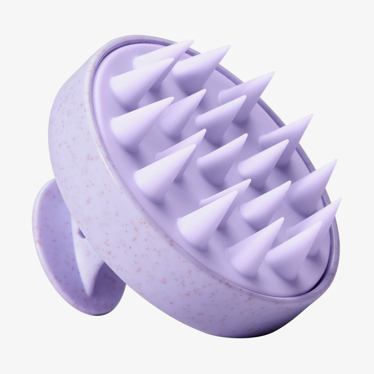 Die maria nila Stimulating Scalp Brush ist eine lavendelfarbene Silikon-Massagebürste mit spitzen Borsten und einem Griff.