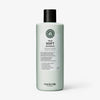 Eine hellgrüne Flasche von maria nila True Soft Shampoo mit schwarzem Deckel und detailliertem Etikett.