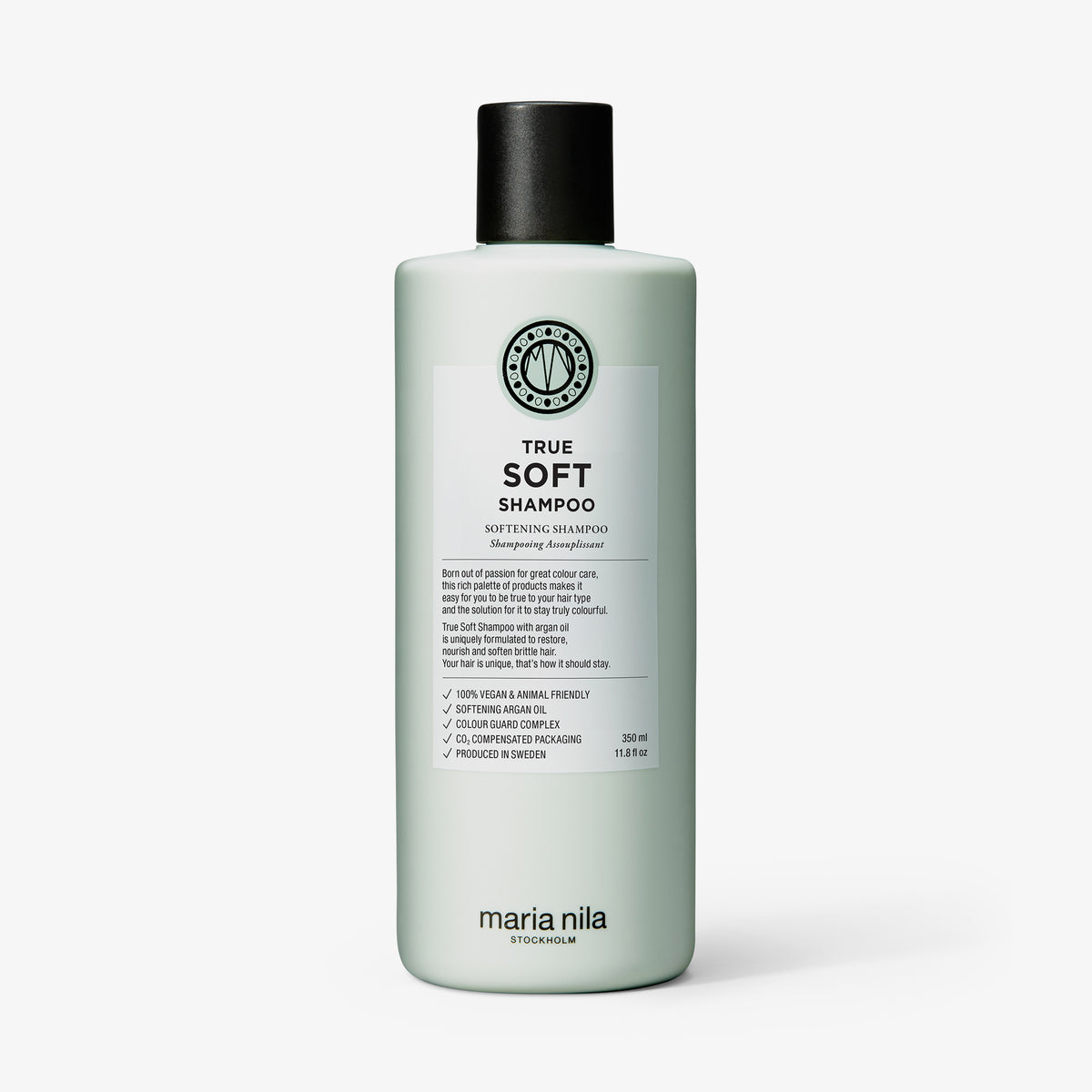 Eine hellgrüne Flasche von maria nila True Soft Shampoo mit schwarzem Deckel und detailliertem Etikett.