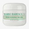 Ein weißer Tiegel mit 56 g von Mario Badescu Whitening Mask mit grünem Text auf dem Etikett.