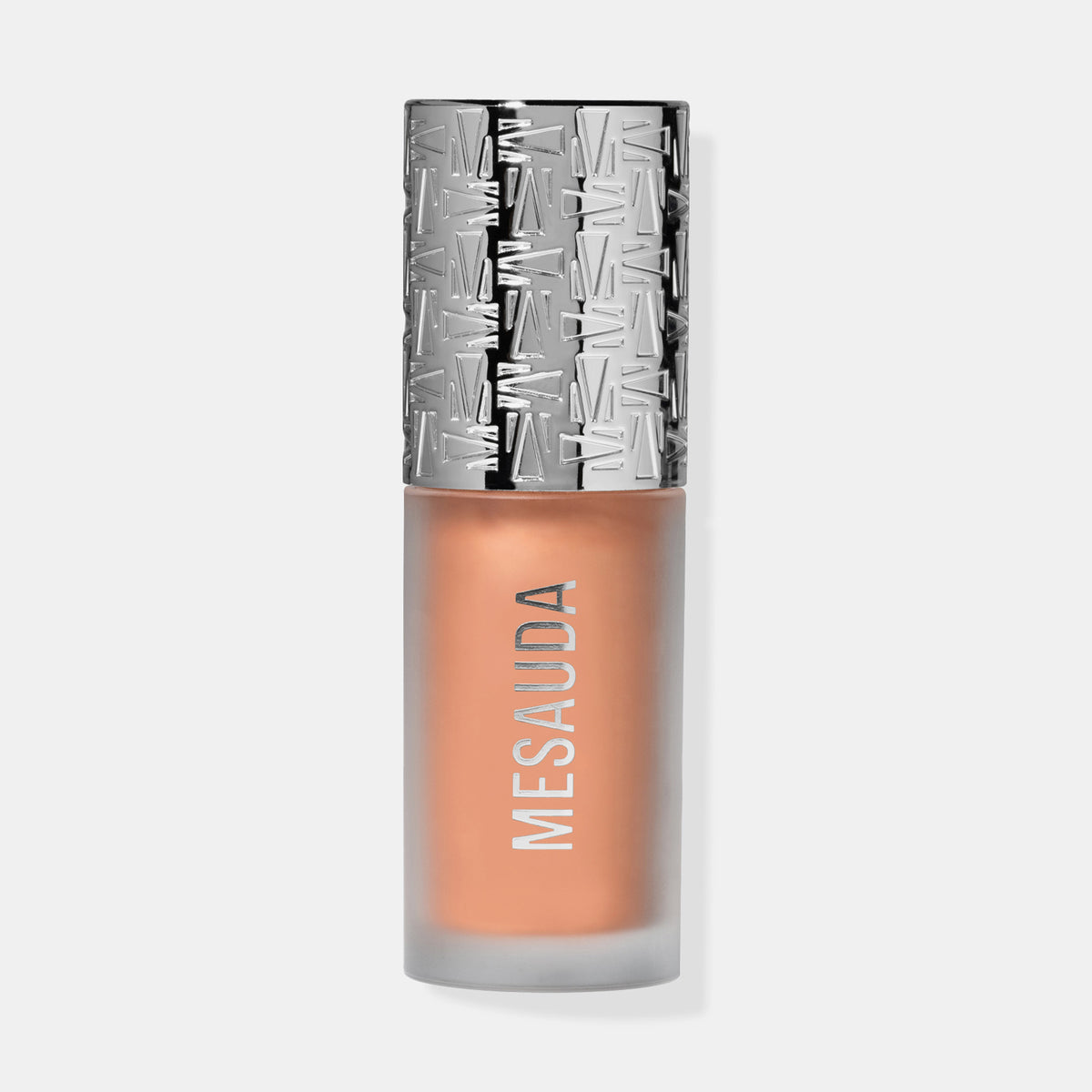 Die Flasche Flush of Light Blossom Shine von Mesauda mit silbergemustertem Deckel und pfirsichfarbenem Inhalt.