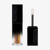 Der Galactic Shadow Flüssigliedschatten von Mesauda Beauty in einer rechteckigen Tube mit dem Deckel und Applikator daneben.
