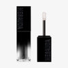 Der Galactic Shadow Flüssigliedschatten von Mesauda Beauty in einer rechteckigen Tube mit dem Deckel und Applikator daneben.
