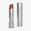 Metallisch-silberne Hydramorphosis-Lippenstifttube mit Mesauda Beauty-Branding und Kappe, die einen warmen braunen Lippenstiftfarbton enthüllt.