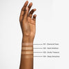 Eine Hand zeigt vier schimmernde Mesauda Beauty Lust For Shine Highlighter-Swatches mit den Nummern 101 bis 104 auf dem Unterarm.