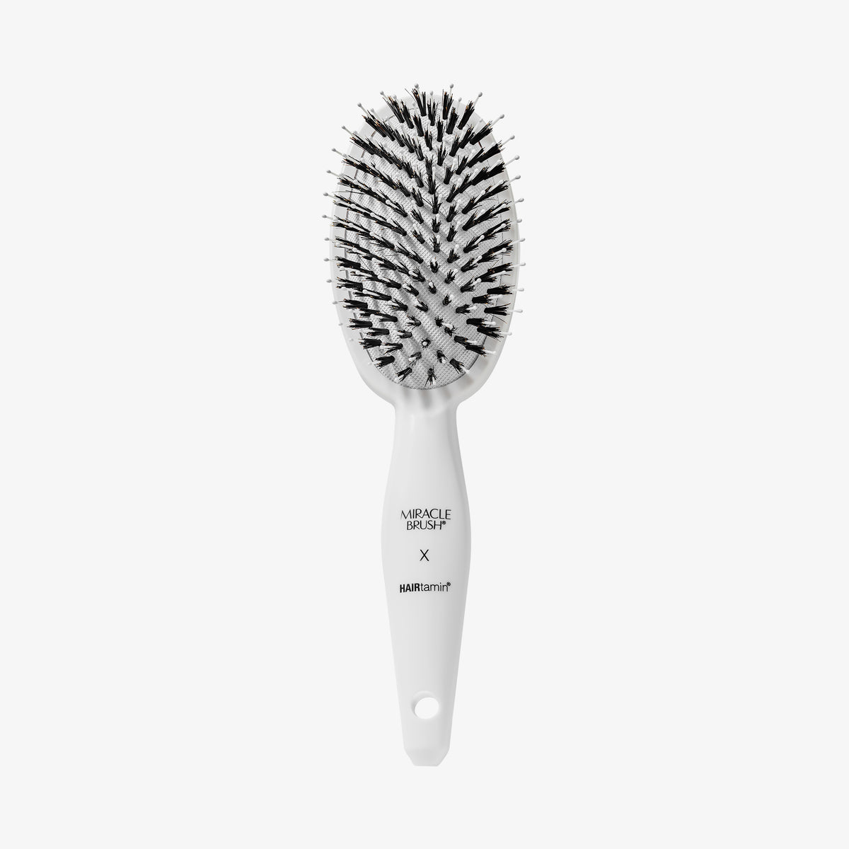 Weiße Miracle Brush® X HAIRtamin® vor weißem Hintergrund.