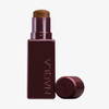 Der NABLA Cosmetics Art Of Skin Foundation Stick in Burgunderrot ist ohne Kappe auf einem weißen Hintergrund abgebildet.