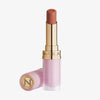 Der Beyond Blurry Lipstick in der Farbe divinize wird in einer rosa-goldenen Tube mit ausgefahrenem Lippenstift und daneben platzierter Kappe gezeigt.