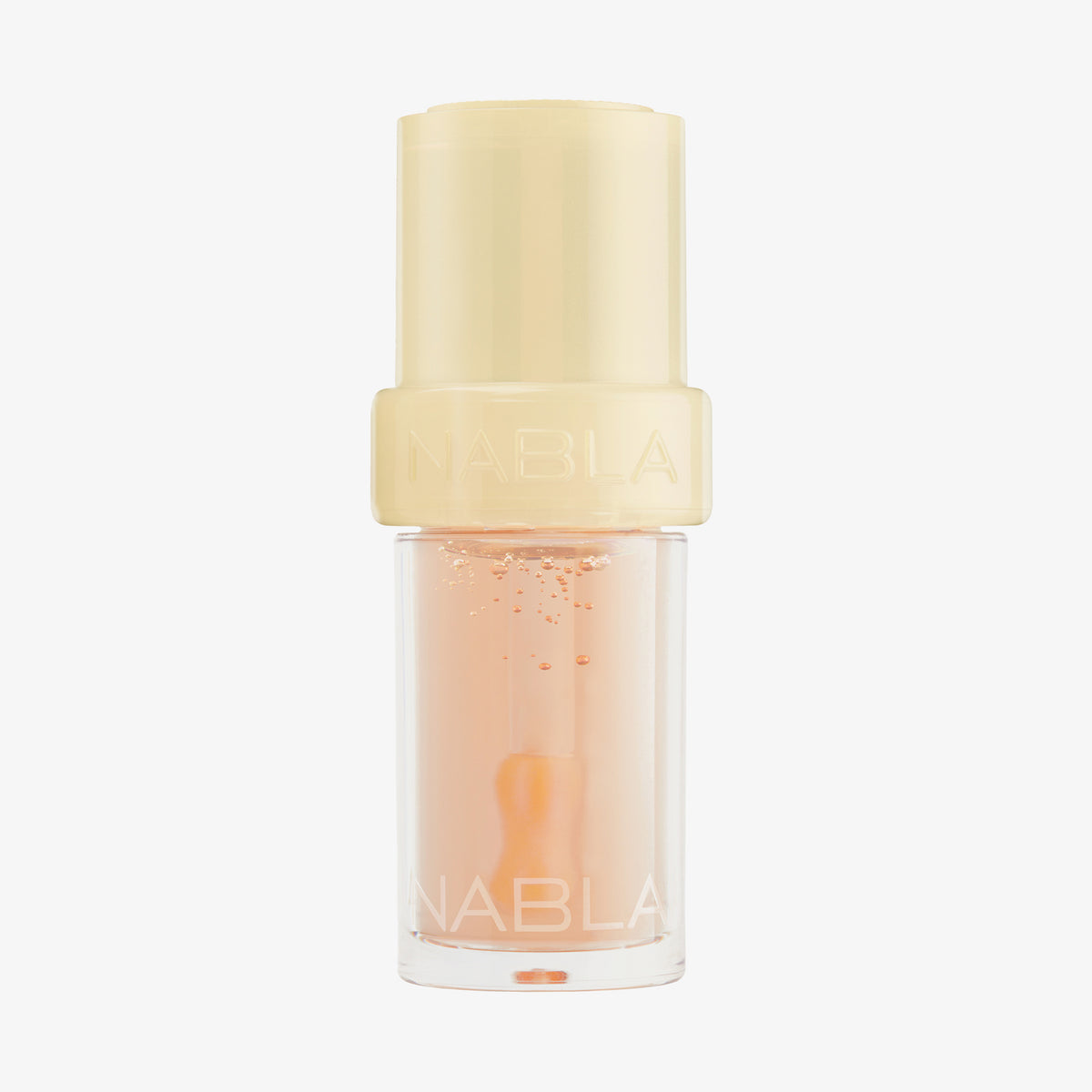 Lip Candy Oil in Honey von NABLA in orangelich-transparenter Verpackung mit gelbem Deckel und glänzender, pflegender Textur.