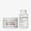 Das OLAPLEX Hydration Heroes-Weihnachtsset 2026 enthält einen weißen Tiegel mit einer intensiv feuchtigkeitsspendenden Maske und eine weiße Flasche mit einem Shampoo zur Pflege der Haarverbindungen.