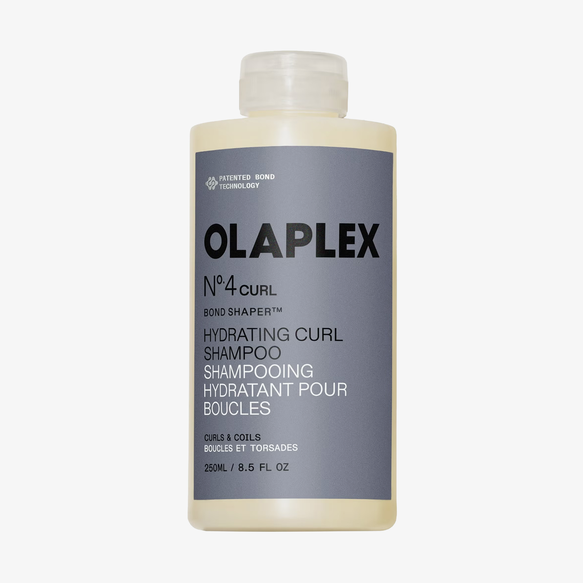 Eine Flasche OLAPLEX N°4 CURLBond Shaper Hydrating Curl Shampoo mit grauem Etikett und schwarzer Beschriftung.