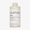 Eine 250-ml-Flasche OLAPLEX N°4 Bond Maintenance Shampoo mit schwarzem Text auf weißem Etikett.