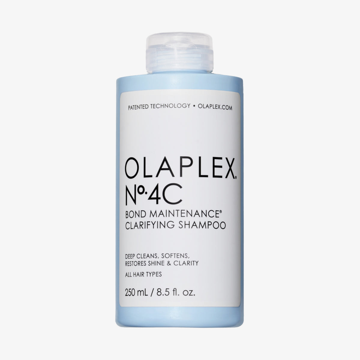 Eine blaue 250-ml-Flasche N°4C Bond Maintenance Clarifying Shampoo von OLAPLEX vor weißem Hintergrund.