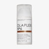 Weiße Pumpflasche N°6 Bond Smoother von OLAPLEX mit transparentem Deckel und schwarzem Text auf dem Etikett.