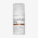 Weiße Pumpflasche N°6 Bond Smoother von OLAPLEX mit transparentem Deckel und schwarzem Text auf dem Etikett.