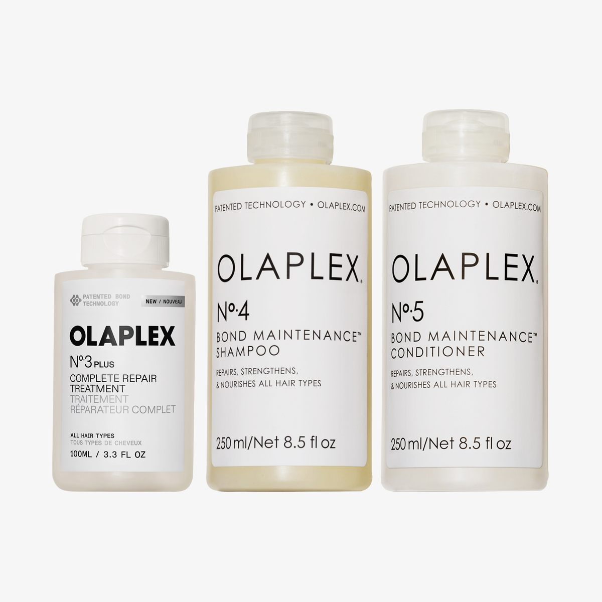 OLAPLEX Total Hair Repair Holiday Kit 2026 mit drei Flaschen: Pflegeprodukt Nr. 3, Shampoo Nr. 4 und Spülung Nr. 5.