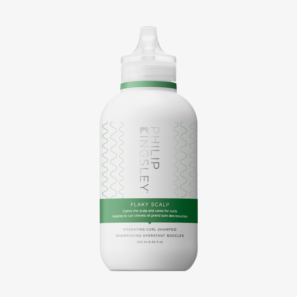 Weiße 250-ml-Flasche des Philip Kingsley „Flaky/Itchy Scalp Hydrating Curl Anti-Dandruff Shampoo“ mit grünen Akzenten und einem durchsichtigen Verschluss.