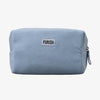 Die PURISH Cosmetic Bag - Kosmetiktasche ist eine hellblaue Tasche mit Reißverschluss und einem weißen PURISH-Etikett auf der Vorderseite.