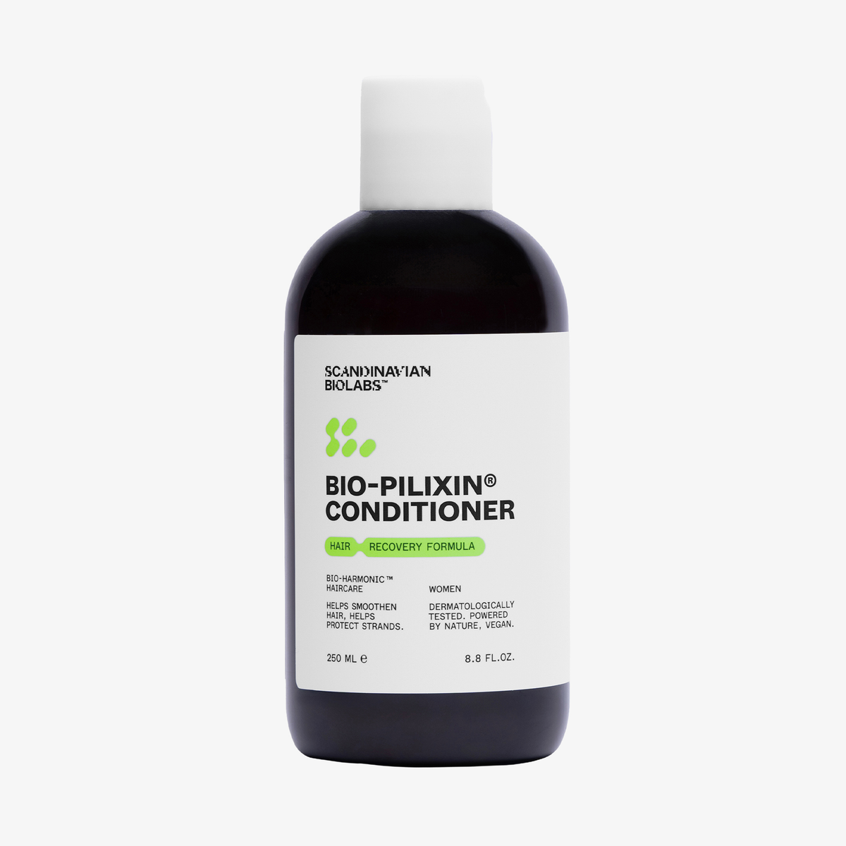 Eine Flasche Scandinavian Biolabs Bio-Pilixin® Conditioner+ Women mit einer weißen Kappe und grünem Text auf weißem Hintergrund.