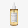 Eine durchsichtige 100ml Tropfflasche mit der Aufschrift „Madagascar Centella Ampoule“ und einer gelben Flüssigkeit darin.