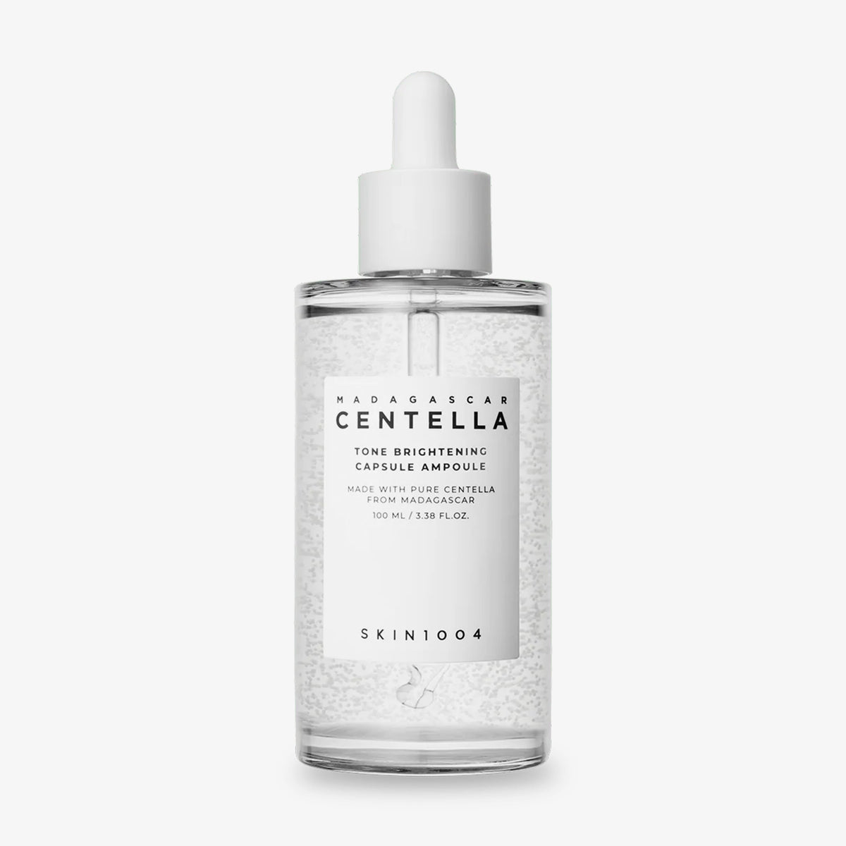 Klare Flasche Madagascar Centella Tone Brightening Capsule Ampoule mit Tropferverschluss und weißem Etikett, 100ml.